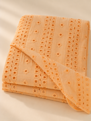 Sunlit Peach Eyelet Embroidered Georgette Fabric